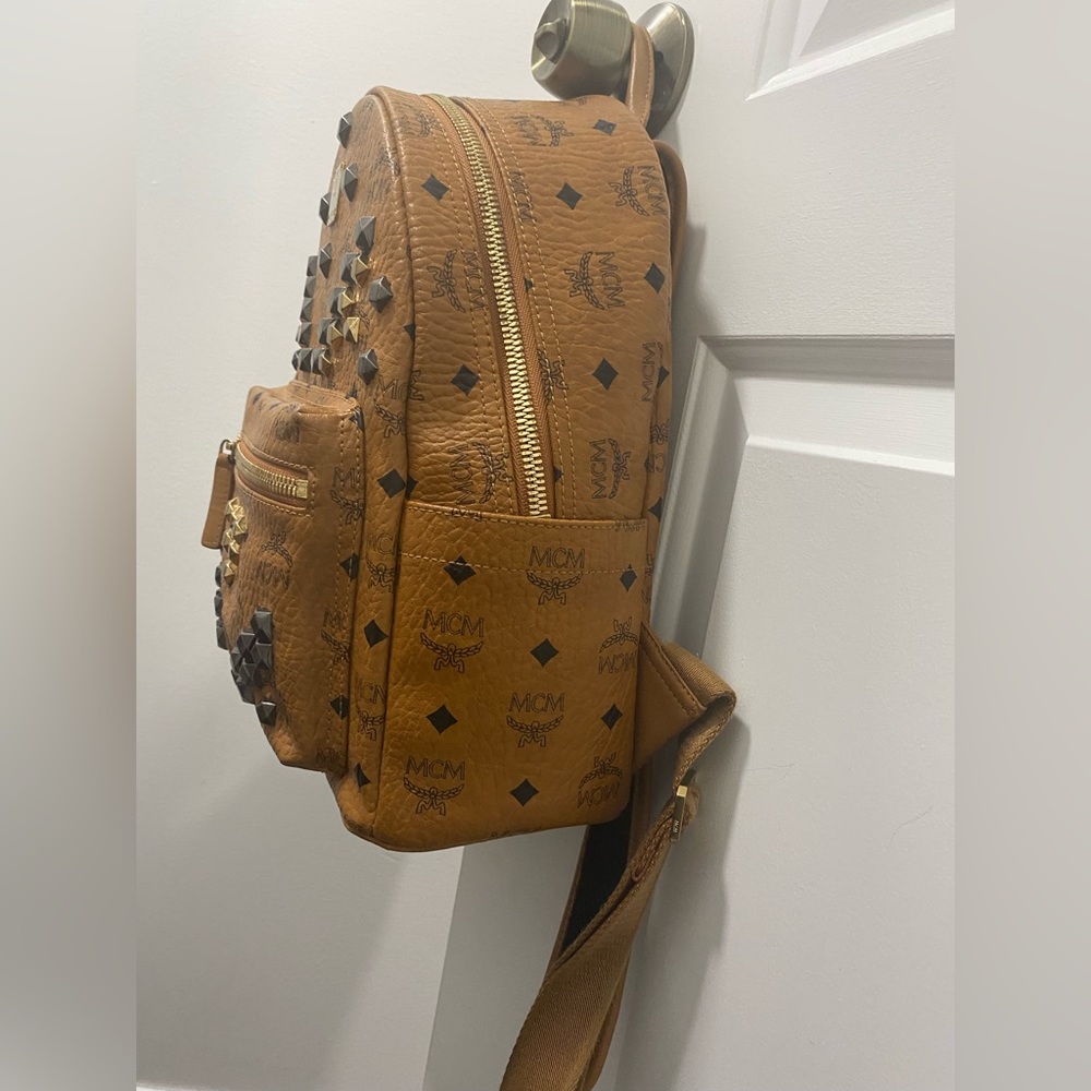 Mcm bookbag brown with studs.This bag is still in excellent condition